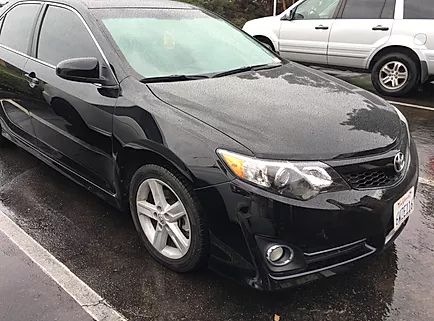 Black sedan after front-end repair
